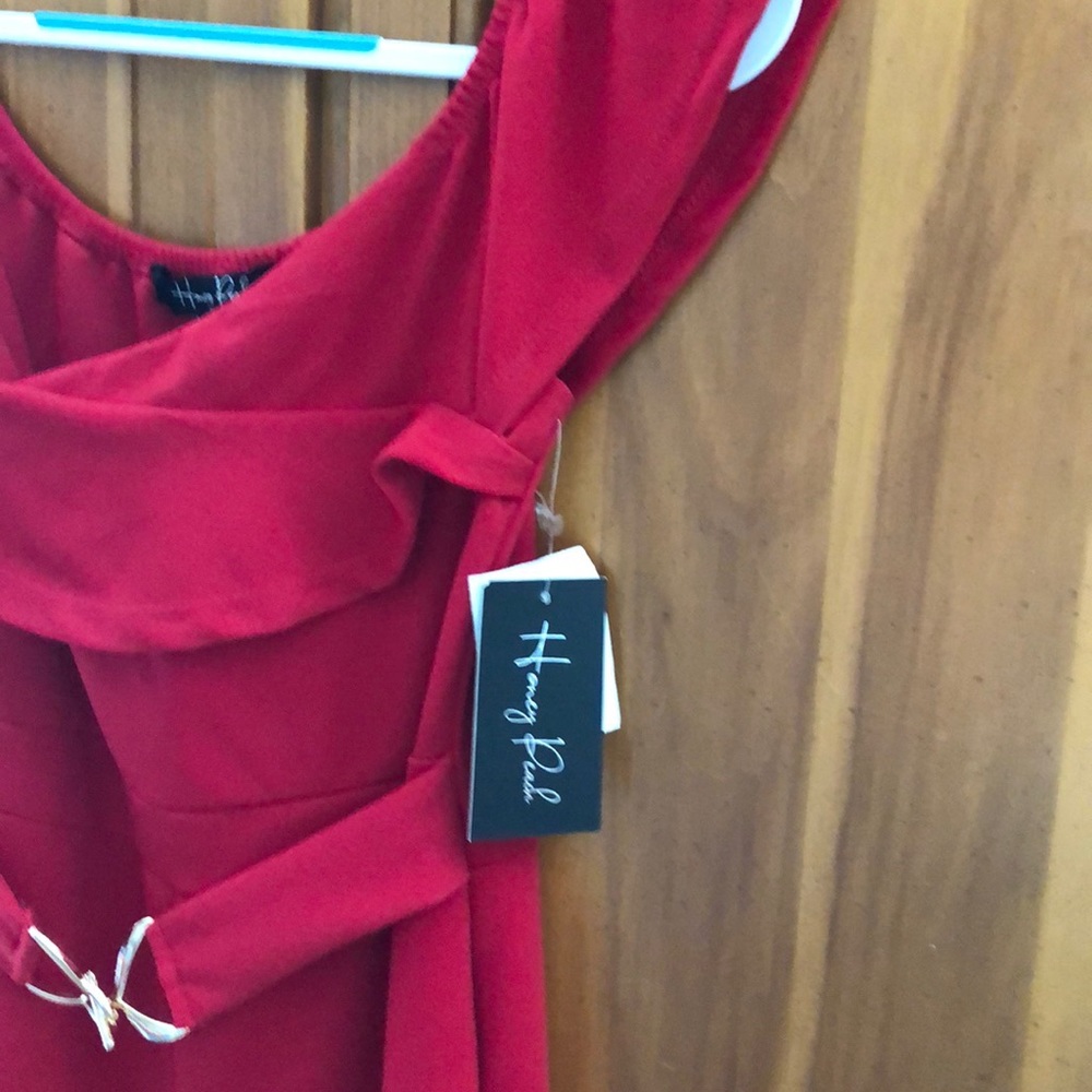 Red jumpsuit brand new with tags. Size L